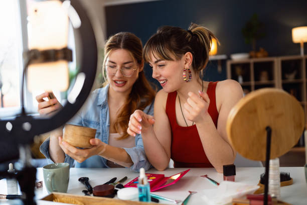 istock Two young women, influencers, testing beauty products for their vlog. 2158548446