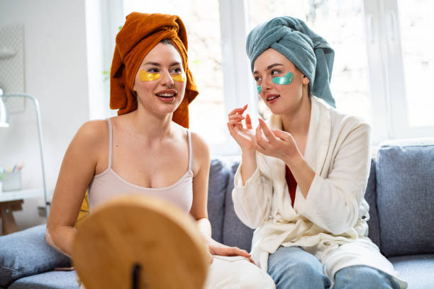 istock Two young women, roommates, doing beauty routine at their shared apartment. 2158549457