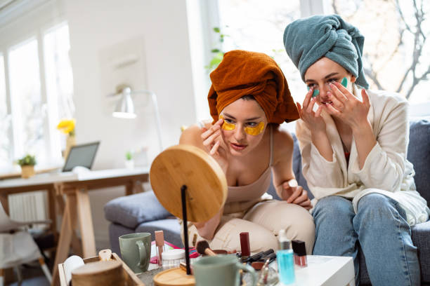 istock Two young women, roommates, doing beauty routine at their shared apartment. 2158549458