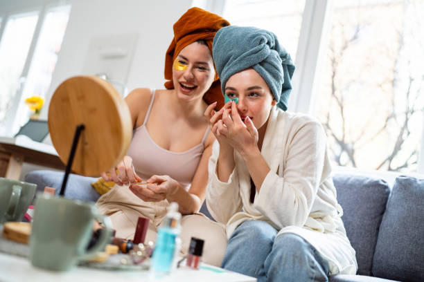 istock Two young women, roommates, doing beauty routine at their shared apartment. 2158549460