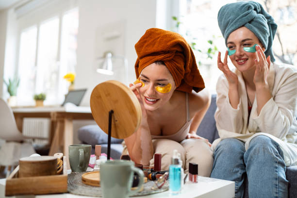 istock Two young women, roommates, doing beauty routine at their shared apartment. 2158549469