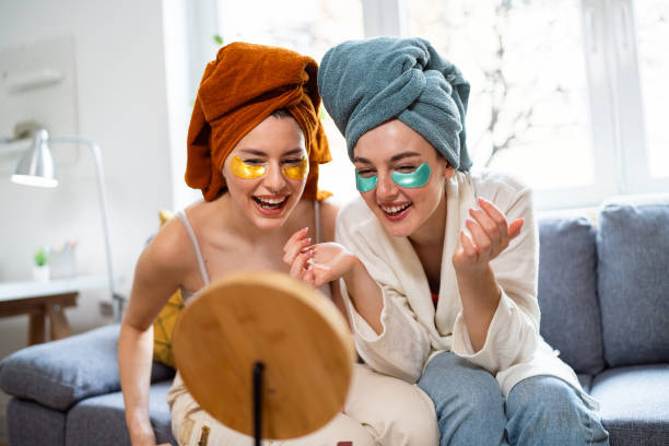 istock Two young women, roommates, doing beauty routine at their shared apartment. 2158549545