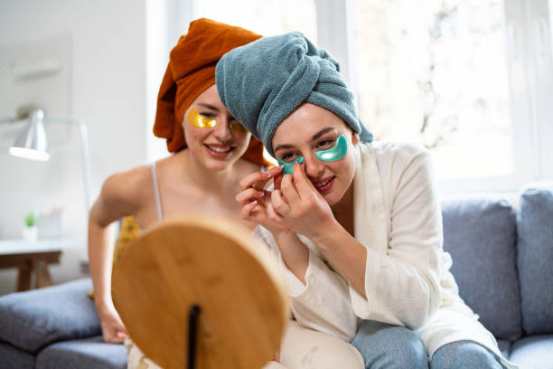 istock Two young women, roommates, doing beauty routine at their shared apartment. 2158549552