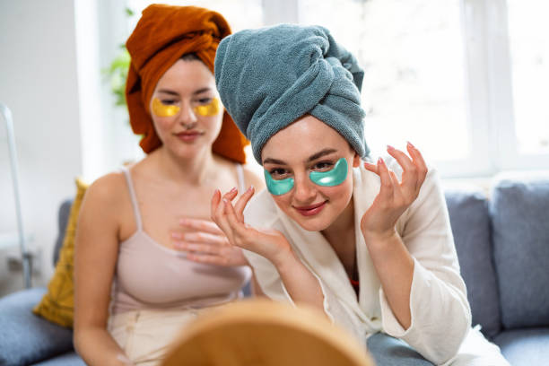 istock Two young women, roommates, doing beauty routine at their shared apartment. 2158549556