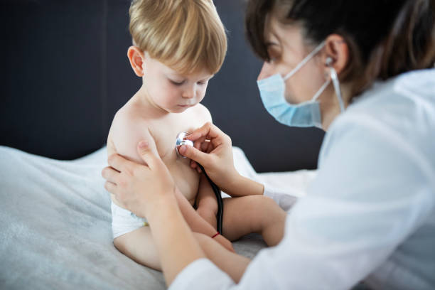 istock Pediatrician at a home visitation,examining a little patient. 2158549669