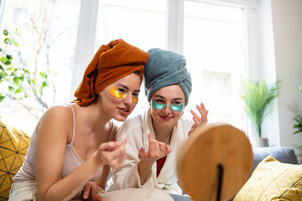 istock Two young women, roommates, doing beauty routine at their shared apartment. 2158549715