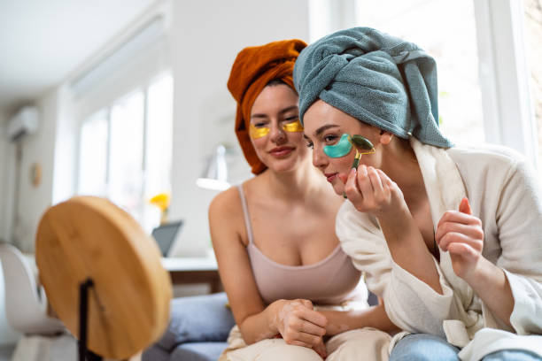istock Two young women, roommates, doing beauty routine at their shared apartment. 2158549719