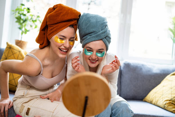 istock Two young women, roommates, doing beauty routine at their shared apartment. 2158549722
