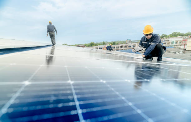 istock engineer man inspects construction of solar cell panel or photovoltaic cell by electronic device. Industrial Renewable energy of green power. factory worker working on tower roof. 2158549727