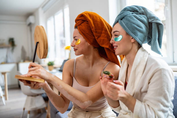 istock Two young women, roommates, doing beauty routine at their shared apartment. 2158549863