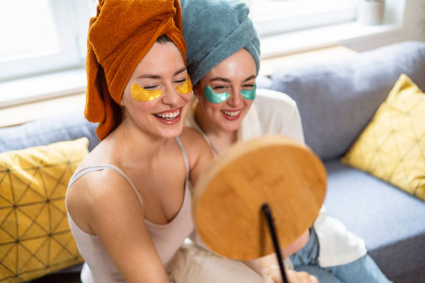 istock Two young women, roommates, doing beauty routine at their shared apartment. 2158549866