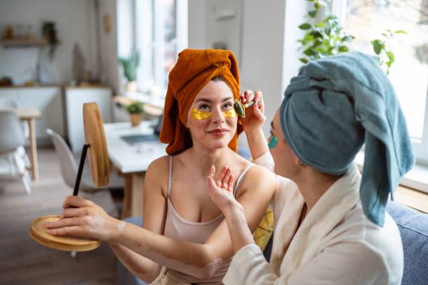 istock Two young women, roommates, doing beauty routine at their shared apartment. 2158549868