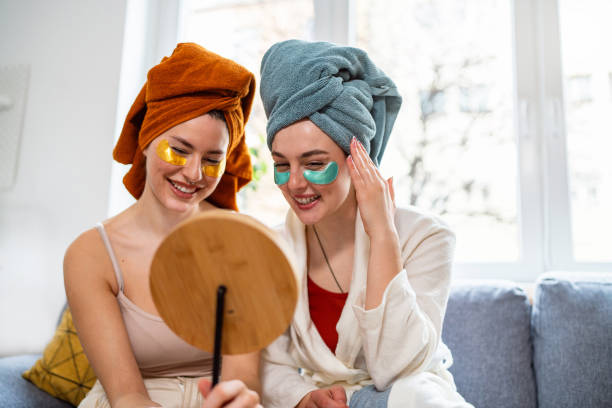 istock Two young women, roommates, doing beauty routine at their shared apartment. 2158549915