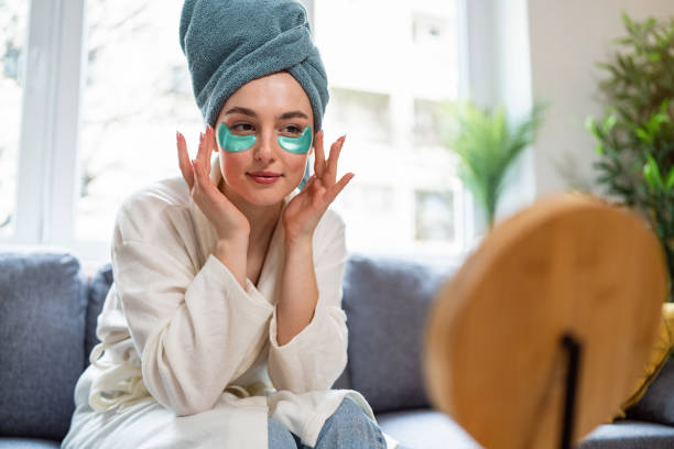 Young woman doing her beauty routine at home