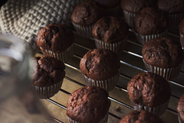 Close-up full frame shot of chocolate muffins on backing rack - Homemade baking,  lifestyle and cozy feeling concept