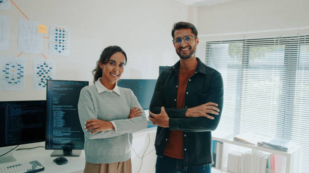 Confident Latinx Programmers Arms Crossed and Smiling in Home Office