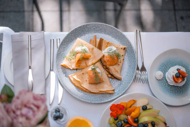 istock Roasted thin pancakes with salmon and sauce 2158551999