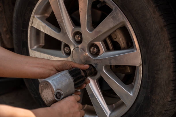 istock Car tire repair 2158552438