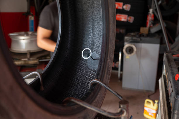 On June 20, 2024, a Chinese auto mechanic was using equipment to repair a car tire.