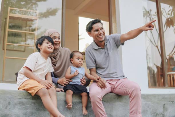 istock Family spending their leisure time outside house. 2158554620