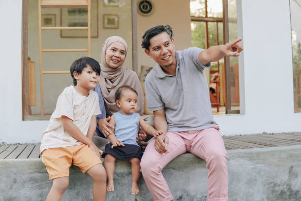 istock Family spending their leisure time outside house. 2158554667