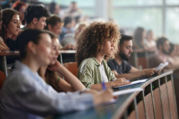 istock Young female student paying attention on a class in amphitheater. 2158554890