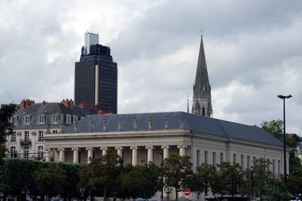 old building of the traditionnal commerce place in Nantes city, with the bretagne tower and saint-nicolas church