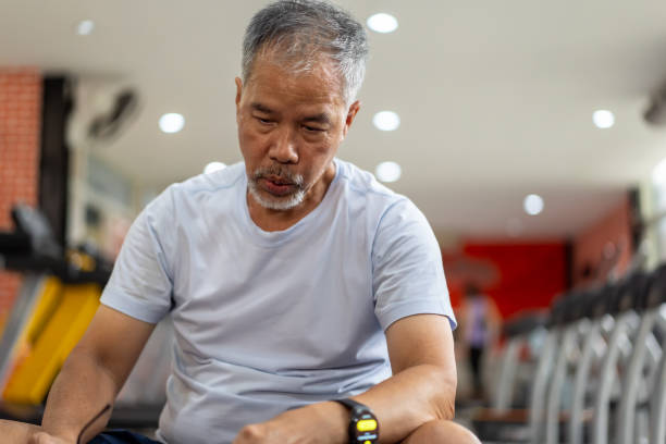 istock senior men play with exercise equipment in the gym. 2158556219