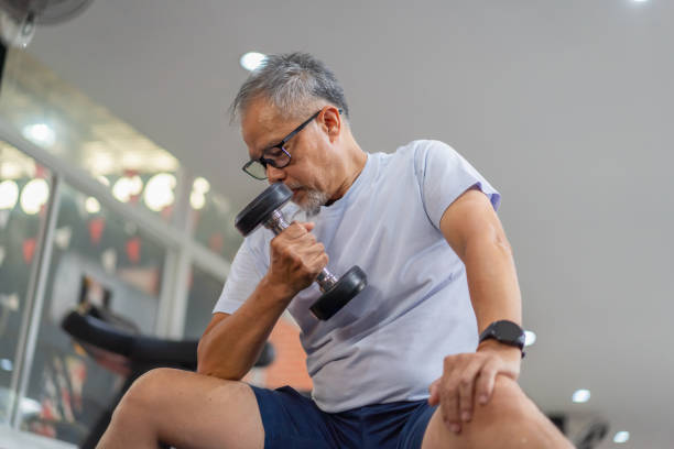 istock senior men play with exercise equipment in the gym. 2158556226