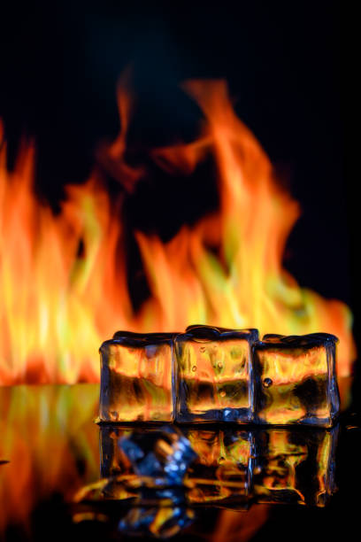 istock fire and ice cubes on a black background, place under the text 3 2158556277