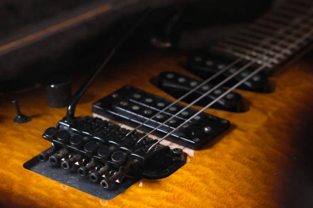 istock Electric guitar bridge and pickups, with its vibrato arm. 2158556619