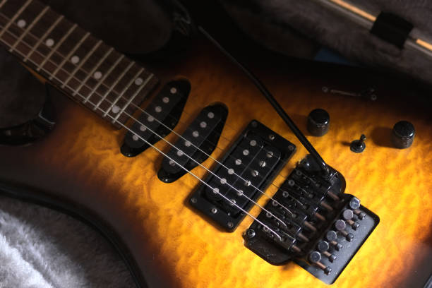 istock Electric guitar bridge and pickups, with its vibrato arm. 2158556620