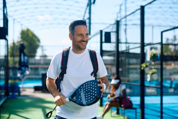 istock Happy athlete coming to paddle tennis exercise class. 2158556631