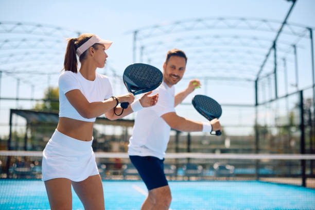 istock Athletic woman having paddle tennis exercise class with her coach. 2158556823