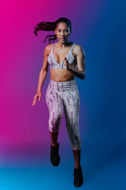 istock Sportive woman doing a high knees 2158558725
