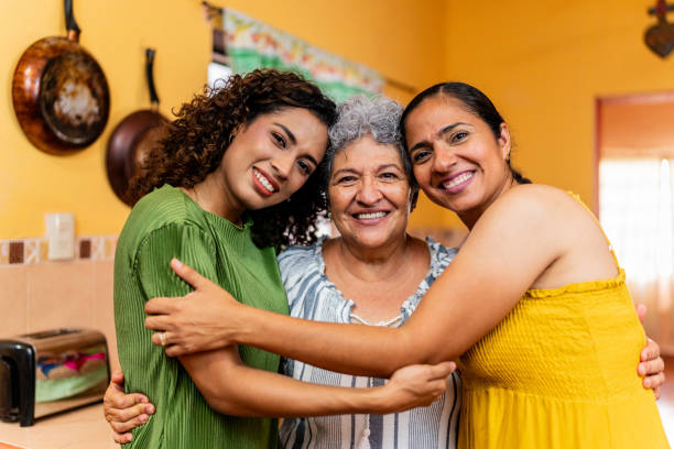 Portrait of family embraced at home Portrait of family embraced at home latinos stock pictures, royalty-free photos & images