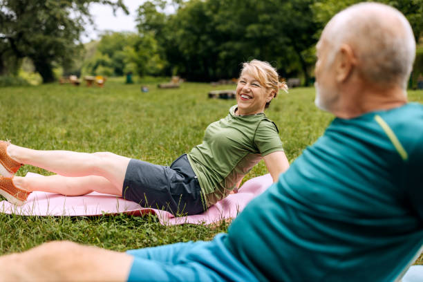 istock Senior couple exercising in nature together 2158563677