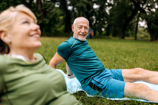 istock Senior couple exercising in nature together 2158563684