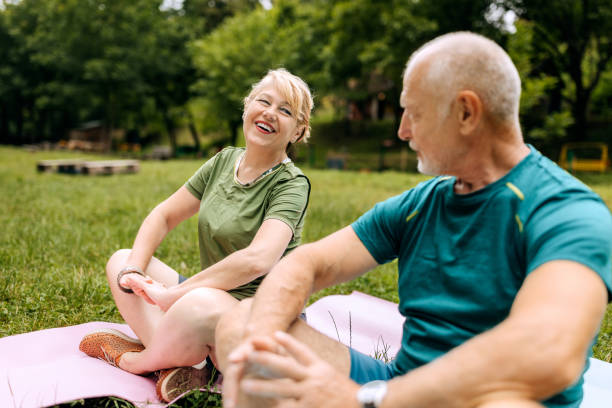 istock Senior couple doing yoga in nature 2158563696