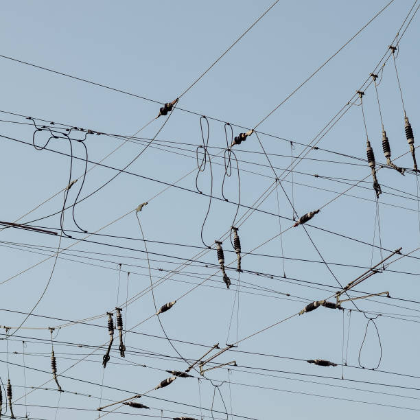 istock Close-up of overhead lines against a blue sky 2158563784