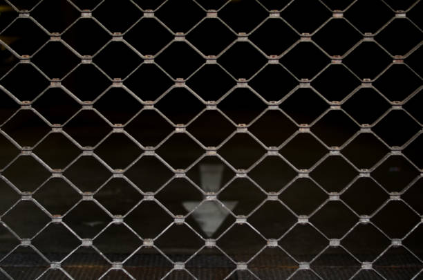 Rolling gate in front of an entrance to a parking garage