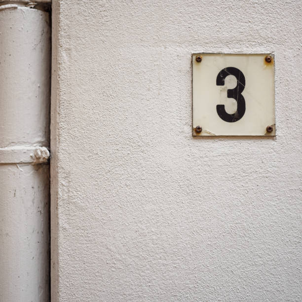 istock Detailed view of a wall with the number three 3 2158563878