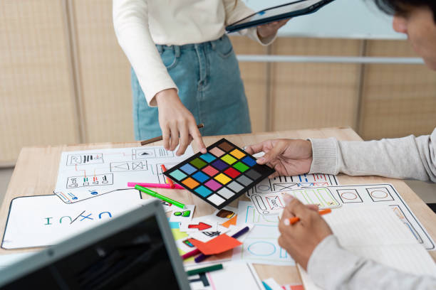 istock Creative UX UI Design Process with Color Palette and Wireframes on Desk, Designers collaboration on User Interface and User Experience, Modern Digital Design Concepts 2158564664