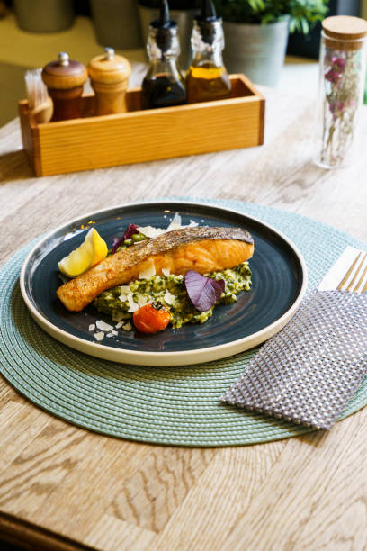 istock Fried salmon with lemon, asparagus, broccoli, scallions 2158566058