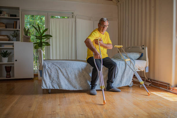 istock Nursing home, an elderly man uses crutches to move 2158566994
