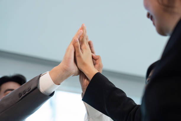 istock Professional Business Meeting with Team Collaboration and High-Five Gesture in Modern Office Setting 2158567100