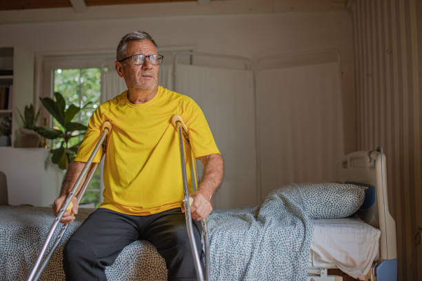 istock Nursing home, an elderly man uses crutches to move 2158567158