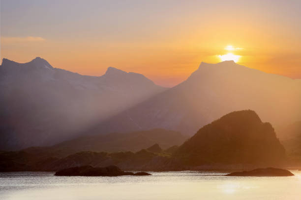Sunset at the Lofoten islands, mountains near the town Svolvaer. The picture was taken from cruise ship Hurtigruten.