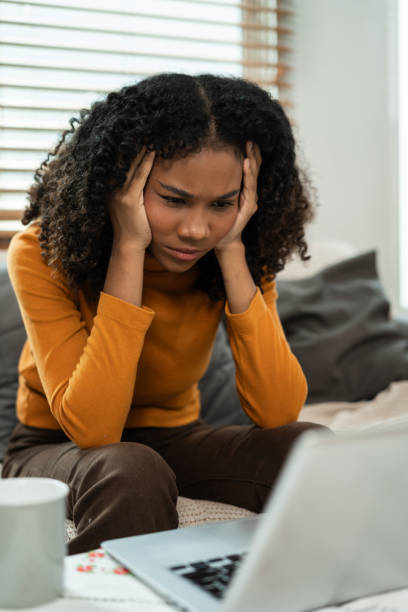 istock Sad and stress young female sitting on the sofa, feel tired, lonely from working for poor work. 2158568615