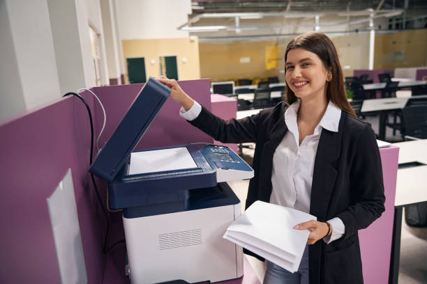 istock Caucasian woman making a copy of documents in the office 2158572881